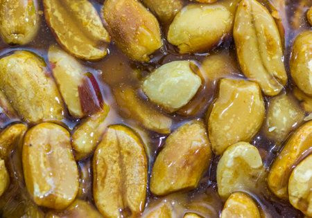 A closeup of peanut candy with transparent sweet honey