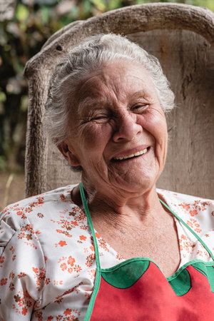 A vertical shot of a smiling Hispanic elderly woman in Tilaran, Guanacaste, Costa Ricaの写真素材