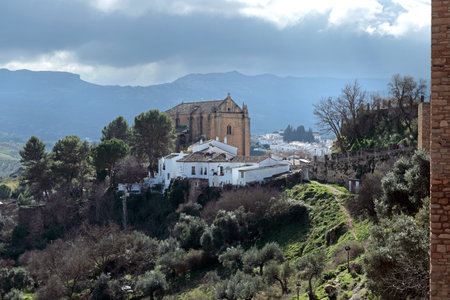 View on the fortified walls and church of Hermandad del Santisimo Cristo de la Sangre in Ronda,...