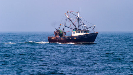 Horizontal photo of a Fishing boat under way in the ocean, Maineの写真素材