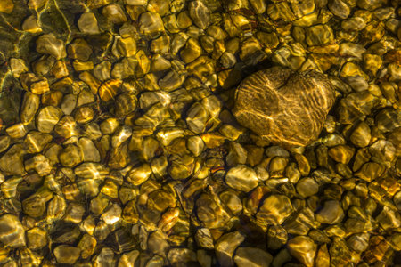 The top view of river stones underwaterの写真素材