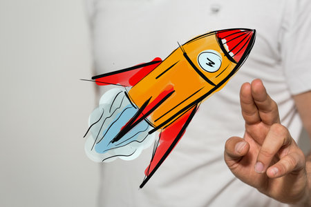 A 3D rendering of a man pointing at a space rocket iconの写真素材