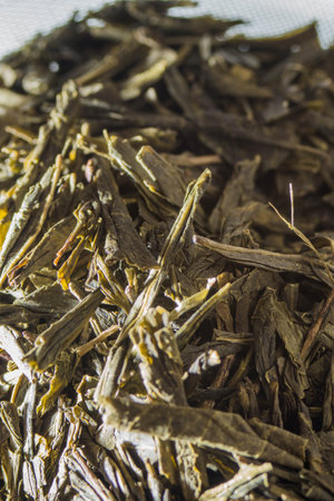 The dried tea leaves on a white surfaceの写真素材