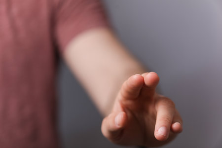A person's hand touching a virtual screenの写真素材