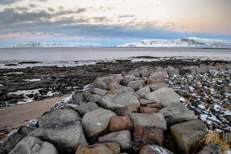 A breathtaking shot of a landscape under the cloudy skies in Icelandの写真素材
