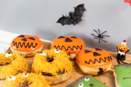 A closeup of Halloween donuts on a table at an eventの写真素材