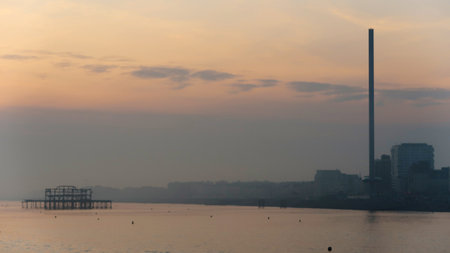 A beautiful view of buildings on a seacoast at sunset