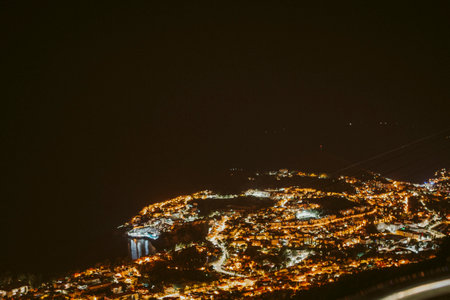 An aerial view of an illuminated city at nightの写真素材