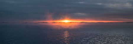 A dramatic view of bright sunset over the sea