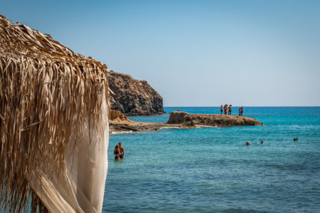 People at Fyriplaka beach in summertimeの写真素材