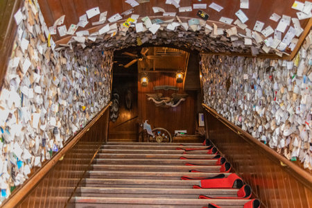 The wooden stairway decorated with paper envelopes.