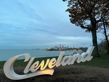 A closeup shot of the Cleveland sign with cityscape in the backgroundの写真素材