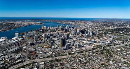 An aerial shot of the cityscape of downtown San Diego, California, surrounded by the oceanの写真素材