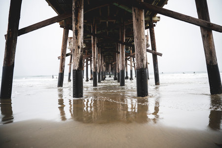 A lower part ot the old wooden pier in the seaの写真素材