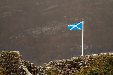 The Scottish flag in a mountainous areaの写真素材
