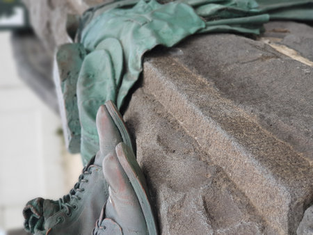 A vertical shot of a pair of old boots and clothes