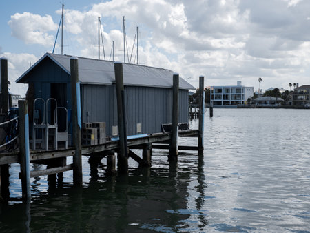 A harbor with lakehouses under a cloudy sky