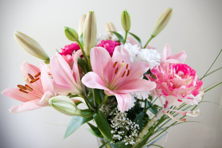 A closeup of a beautiful pink flower bouquet on a white backgroundの写真素材