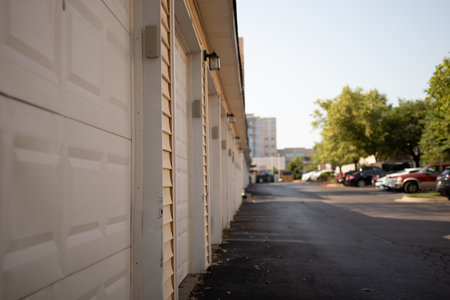A row of white garages in a car parking areaの写真素材