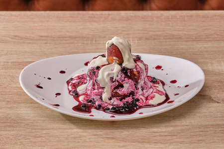 A closeup shot of a traditional Romanian cream on a white plateの写真素材