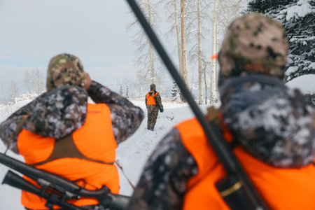 The hunters in a snowy landscape