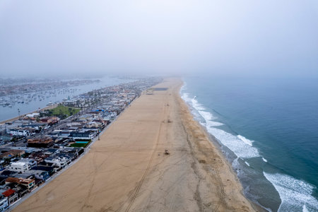 An aerial view of the sandy coastline in Newport Beach, California, USA