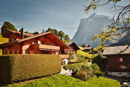The view of the rural houses with the mountain peak in the background. Switzerland.
