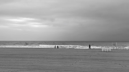 A grayscale Beautiful scene of a seascape against a cloudy sky