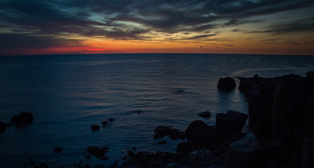 A mesmerizing shot of a seascape during the sunsetの写真素材