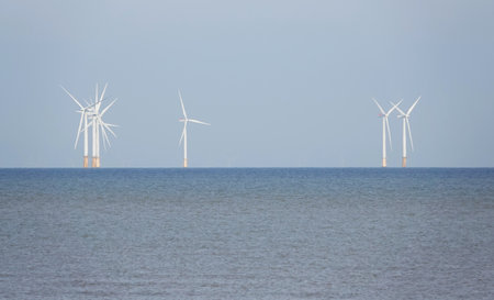 A beautiful view of wind turbines in the North Sea off the coast of Norfolk, UK