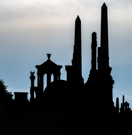 The silhouettes of monuments in Necropolis, Glasgow, Scotlandの写真素材