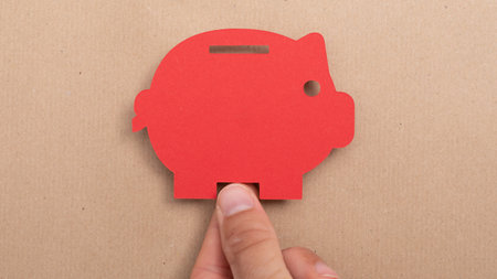 A person holding a piggy bank - money finance capital concept wealthの写真素材