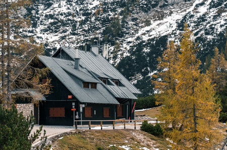 The postman's lodge on the Vrsic mountain pass surrounded by trees in Julian alps in Slovenia