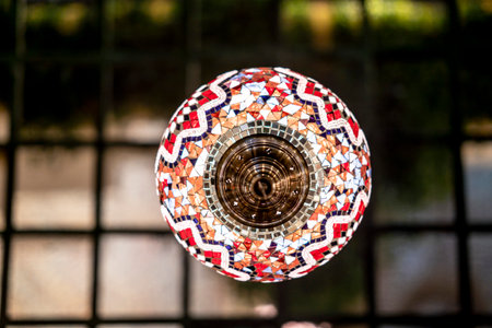 A Closeup of a lamp with colorful decorative shiny crystalsの写真素材