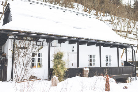 A wooden textured house in Spania Dolina, Slovakia in winterの写真素材