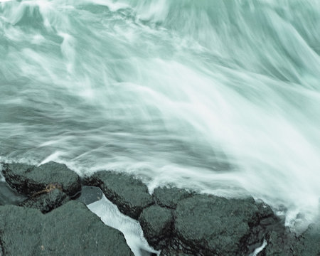 A closeup shot of a flowing blue river