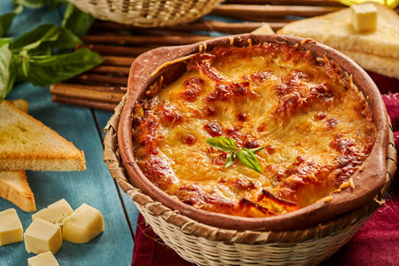 A freshly-made lasagna on a tableの写真素材