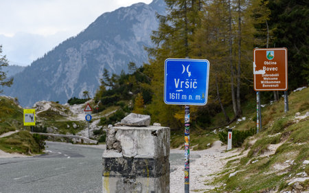 A road sign on top of Vrsic mountain pass road in the Julian Alps in Sloveniaの写真素材