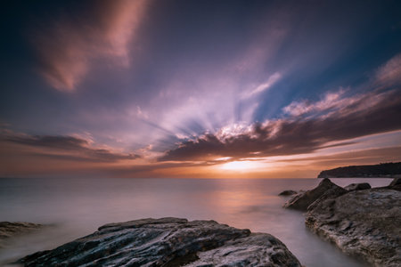 The beautiful seascape at sunset with rock formations in the water