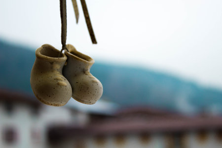 A selective focus of a handmade shoes toy Christmas decoration
