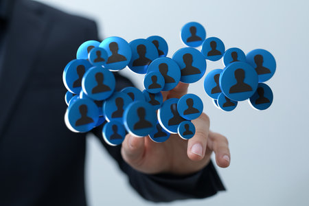 A businessman pointing at a unity group and teamwork conceptの写真素材