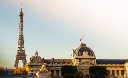 A beautiful view of an Eiffel tower and a military school under a clear sky in Parisの写真素材