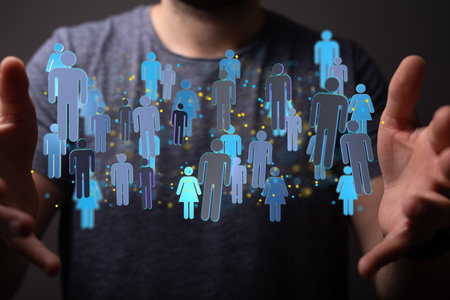 A male hand silhouette showing a digital organization networkの写真素材