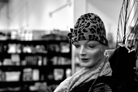A grayscale closeup of the female mannequin with a leopard hat.の写真素材