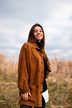 A beautiful Caucasian female enjoying walking in the fieldの写真素材