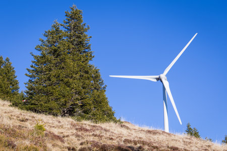 Windpark at the Handalm mountain range in Styria, Austria in autumn with blue clear skiesの写真素材