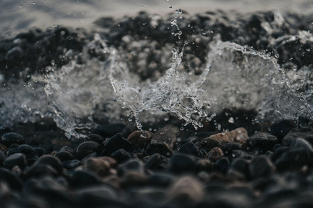 A macro shot of the water splash on the beach rocks in the northwest Pacific