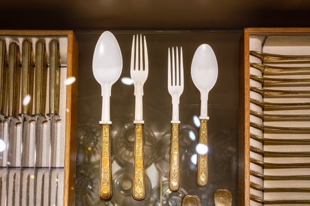 A closeup shot of luxury spoons and forks in the wooden boxesの写真素材