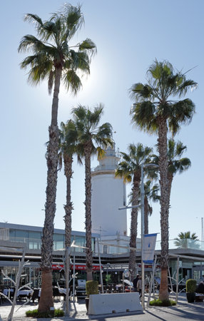 Bright white lighthouse of Malaga on a sunny winterday against a blue sky.のeditorial素材