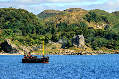 A Steamship with Duntrune Castle in the background in Argyll, Scotland